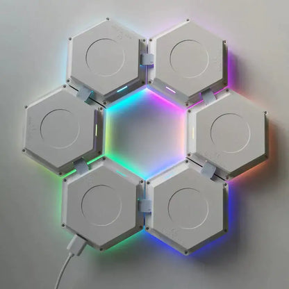 White hexagonal led wall lights arranged in a flower pattern emitting vibrant rainbow colors with bluetooth app control