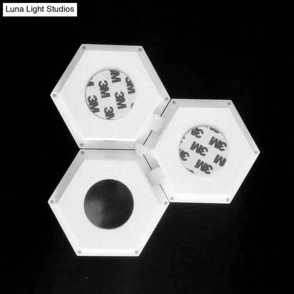 White hexagonal modular led wall lights with adhesive backing for bedroom featuring bluetooth app control and remote control