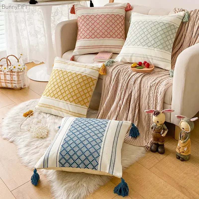 Set of four woven blue diamond jacquard cushion covers with pastel tones and colorful tassels for living room decorbites decor
