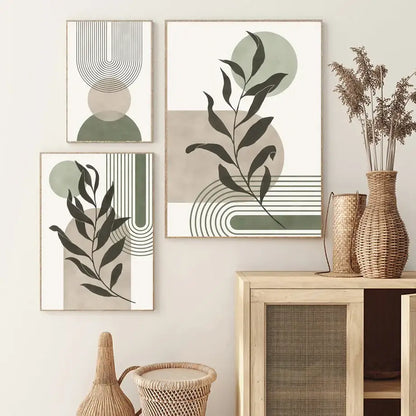 Three framed abstract geometric leaves canvas wall art prints in muted green beige black and white tones by decorbites™