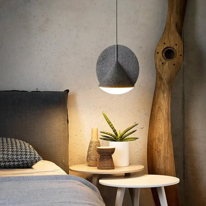 A modern gray pendant lamp with textured fabric shade in matte copper and charcoal gray for kitchen decorbites colorful led