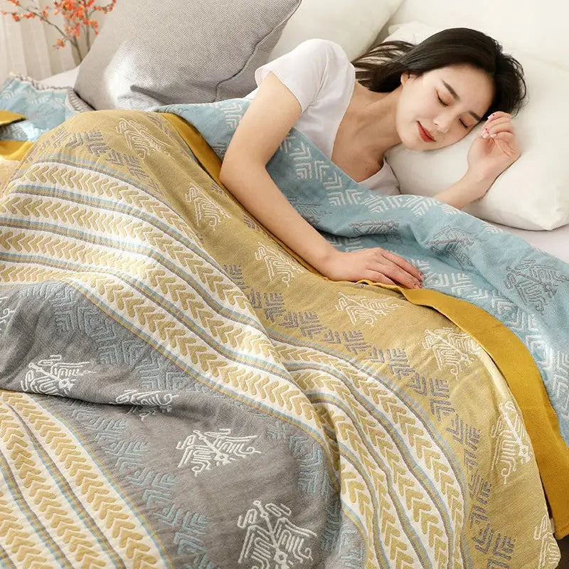 A cozy geometric mustard and gray cotton gauze summer blanket by decorbites with a multi-colored pattern