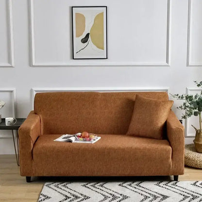 Warm brown textured fabric sofa cover snugly fitted on modern loveseat featuring decorbites colorful block design