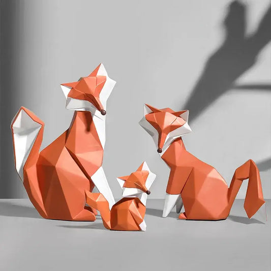 Geometric orange and white decorbites fox figurine set with angular origami-inspired design for living room decor
