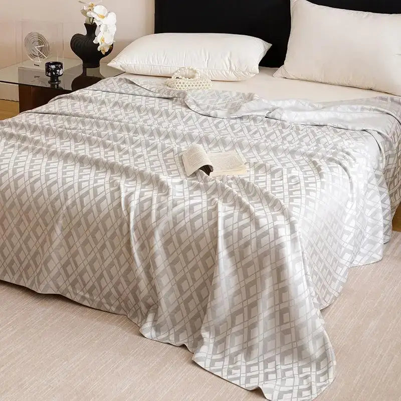 A soft light gray quilted bamboo fiber summer bedspread with subtle darker gray geometric pattern for decorbites bedding