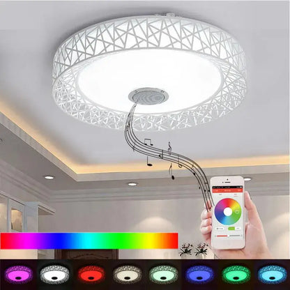 White circular ceiling light with geometric lattice design and integrated decorbites bluetooth speaker and color-changing led