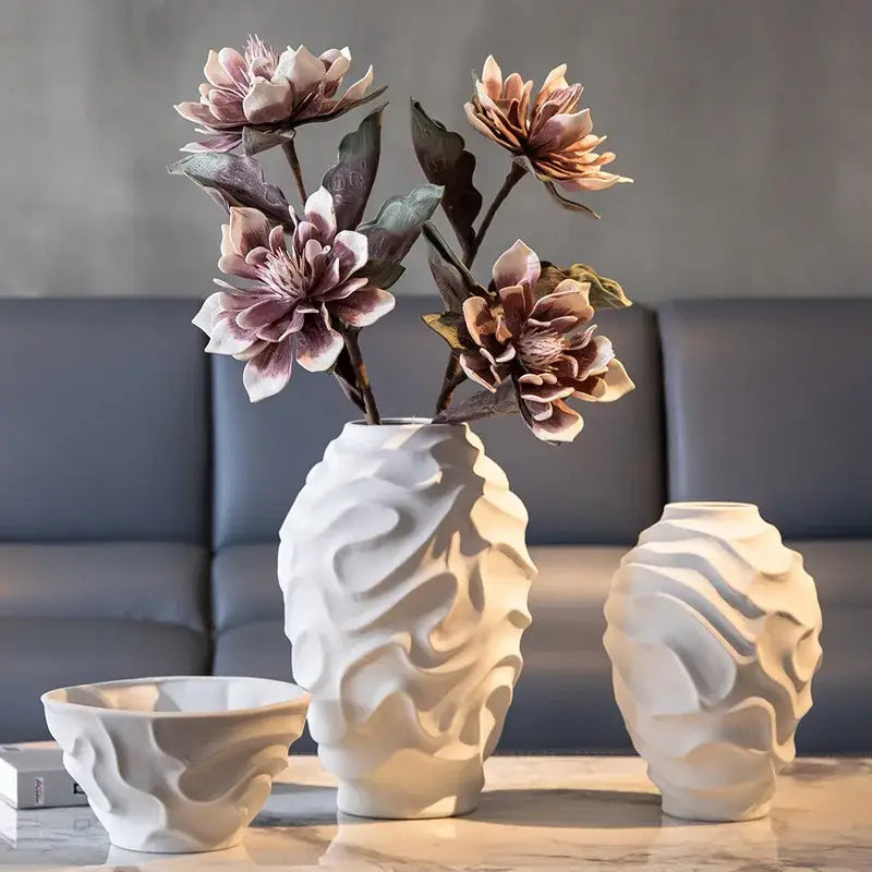 White ceramic geometric spiral vase with wavy texture and flared opening for fruit platter and home decor