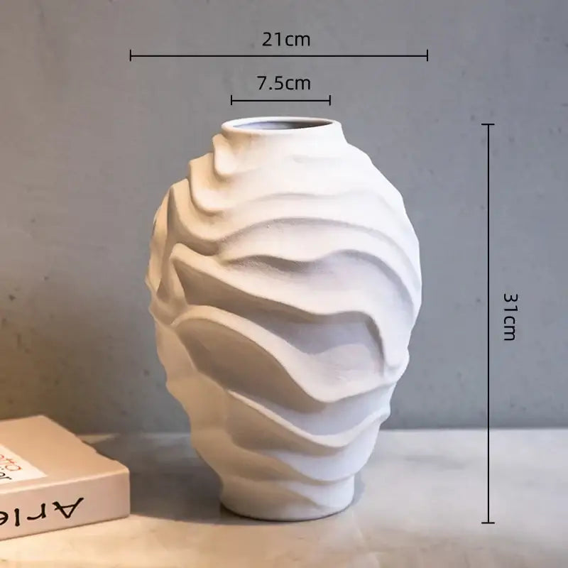 A white ceramic geometric spiral vase with wavy texture 31cm tall ideal for fruit platter and home decor