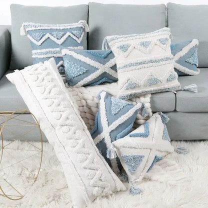 Set of geometric tassel tufted blue and white pillow covers with star patterns and textured tassels for living room