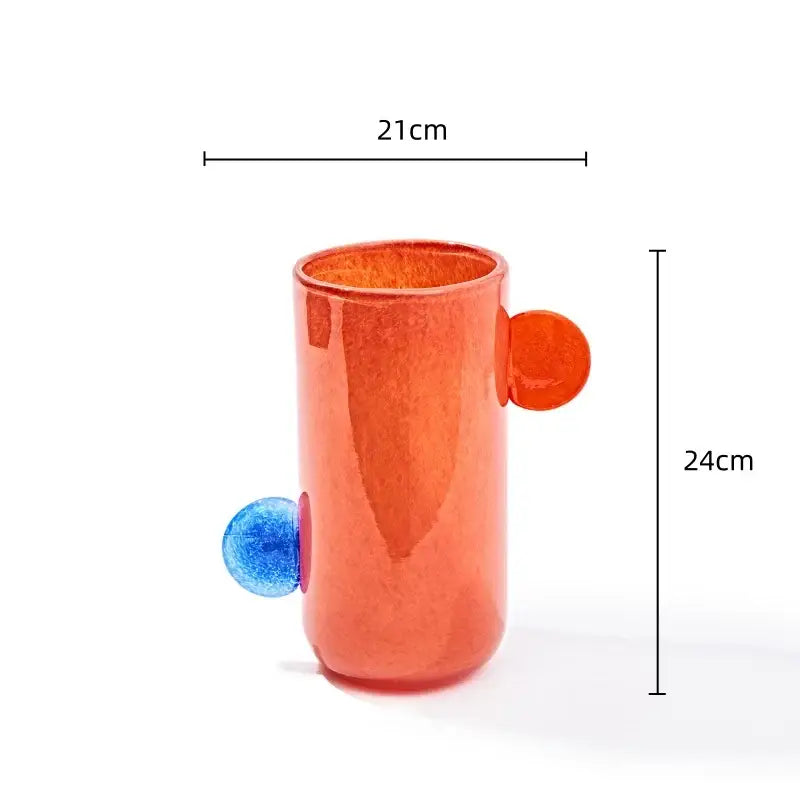 Vibrant orange translucent geometric glass vase with blue and orange spherical handles for decorbites geometric decor
