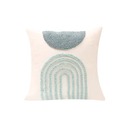 A cream pillow cover with a light blue plush geometric tufted diamond and half-circle design for decorbites decor