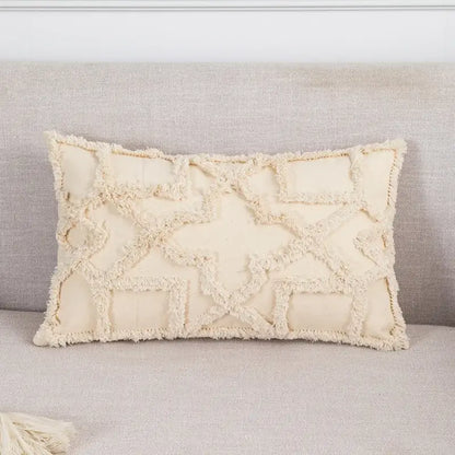 Cream-colored rectangular cushion cover with decorbites geometric tufted fringed pattern and tassel trim for living room decor