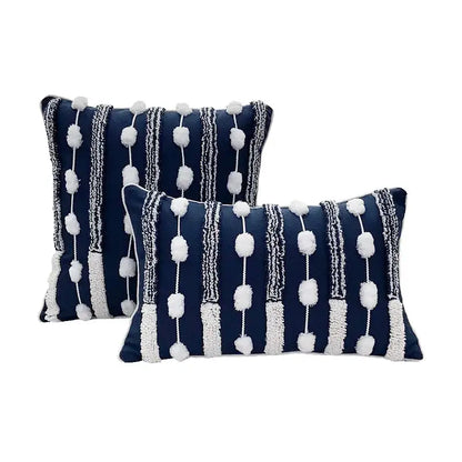 Navy blue rectangular geometric tufted cushion cover with white pom-pom and textured stripe decorbites geometric tufted accents