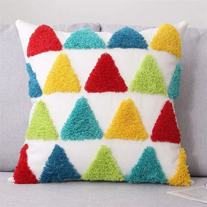 A vibrant geometric tufted cushion cover with colorful fuzzy triangles in red yellow teal and lime green for living room decor
