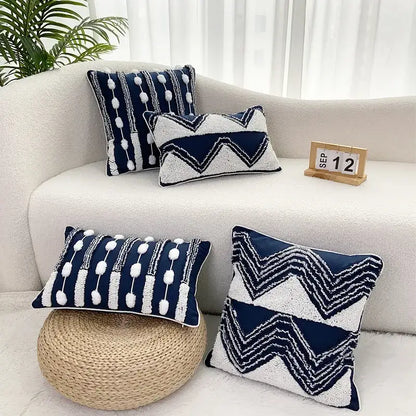Navy blue and white geometric tufted cushion cover with textured fabric and pom-pom tassel decor for living room
