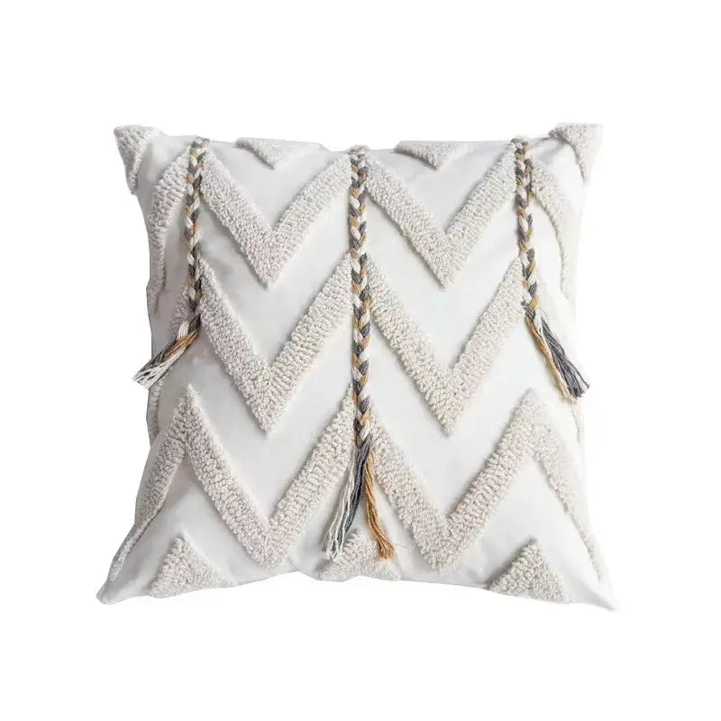 A square white cushion cover with geometric tufted chevron pattern and three braided tassels for living room decorbites geometric tufted decor