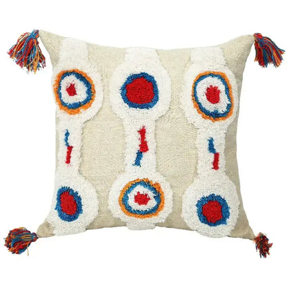 Beige cushion cover with colorful embroidered circular patterns and multicolored tassels for decorbites geometric tufted decor