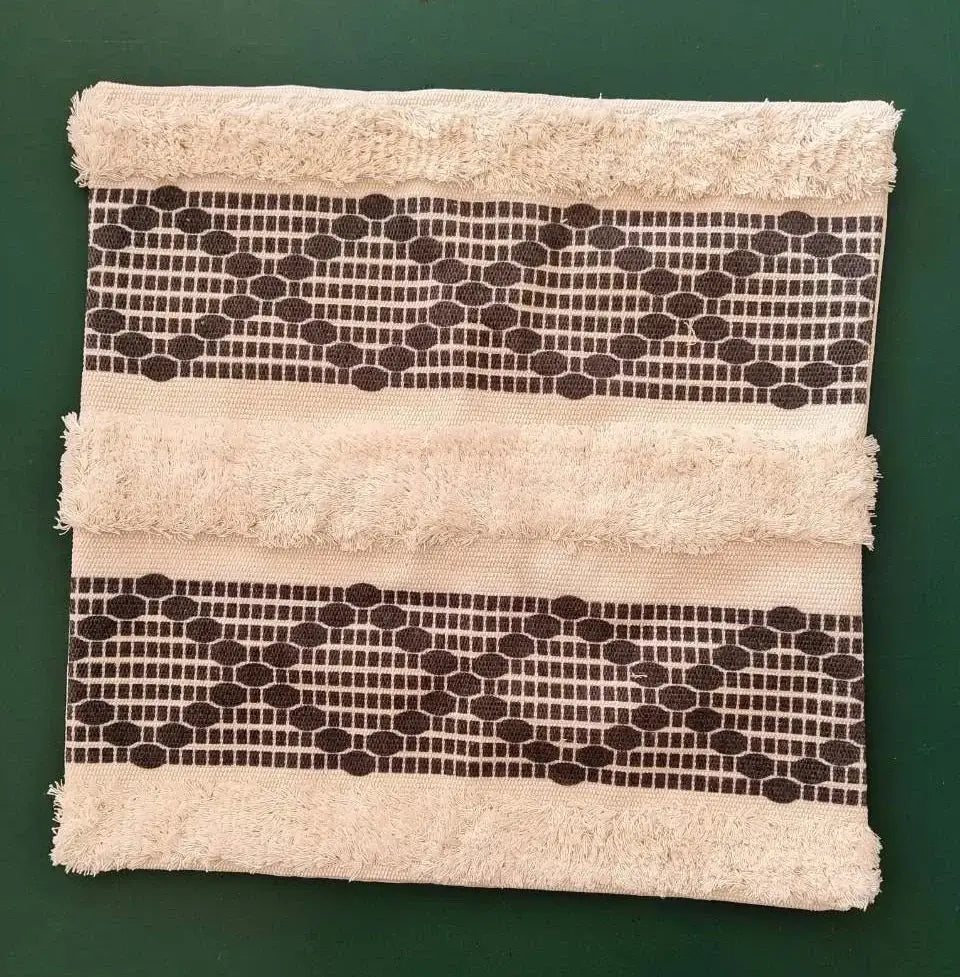 Beige towel with frayed edges and two dark brown geometric bands for decorbites geometric tufted cushion cover decor