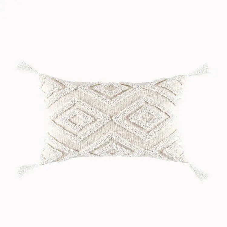 Cream-colored cushion cover with textured geometric tufted pattern and tassels for decorbites geometric tufted decor