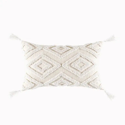 Cream-colored cushion cover with textured geometric tufted pattern and tassels for decorbites geometric tufted decor
