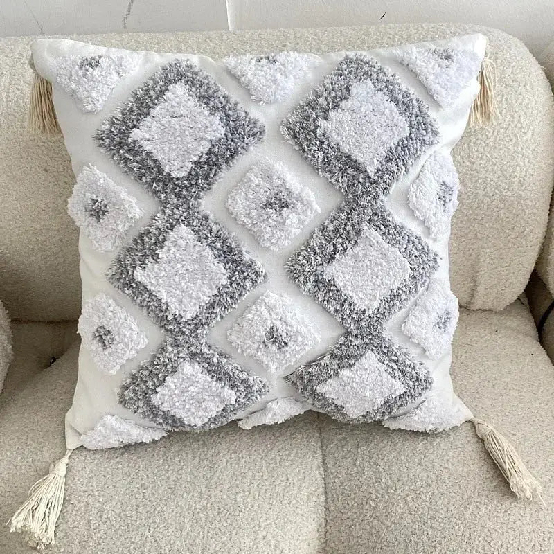 Beige cushion cover with colorful embroidered circular patterns and multicolored tassels for decorbites geometric tufted tassel decor