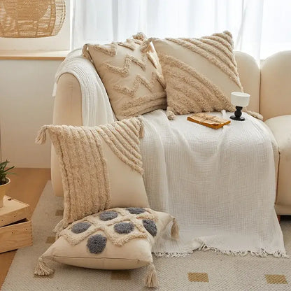 Beige cushion cover with geometric tufted tassel embroidery and tassel trim for living room decor