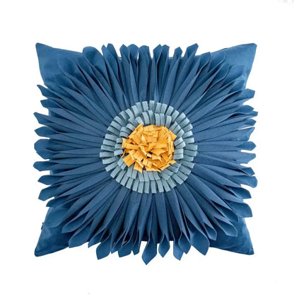 Blue floral cushion cover with layered petal design and central yellow-orange textured center for geometric tufted tassel decor