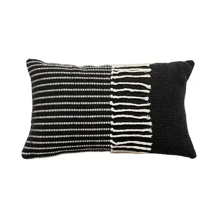 Black and white woven rectangular cushion cover with textured knit pattern featuring decorbites geometric tufted tassel design