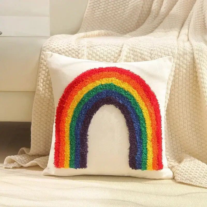 Cozy white cushion cover with vibrant geometric tufted tassel rainbow design in classic hues for decorbites living room decor