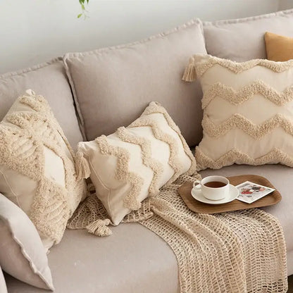 Cream-colored geometric tufted tassel pillowcases with textured fringed zigzag patterns in beige cotton linen decorbites style