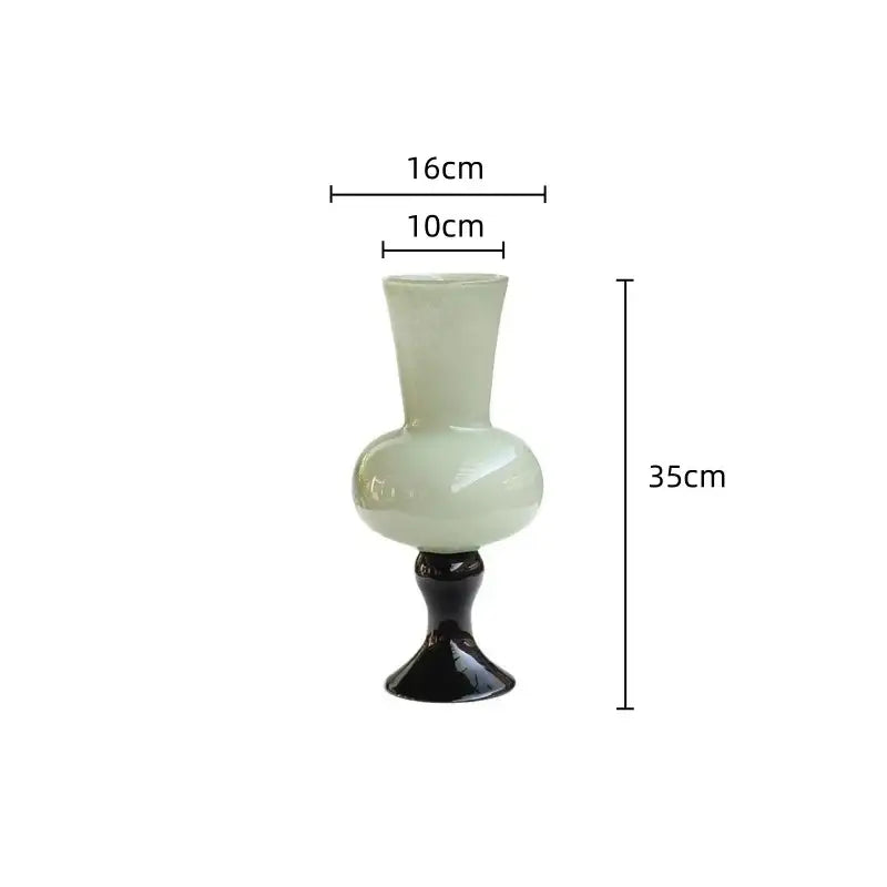 A sleek translucent pale green vintage glass vase with glossy black base for decorbites geometric vintage decor