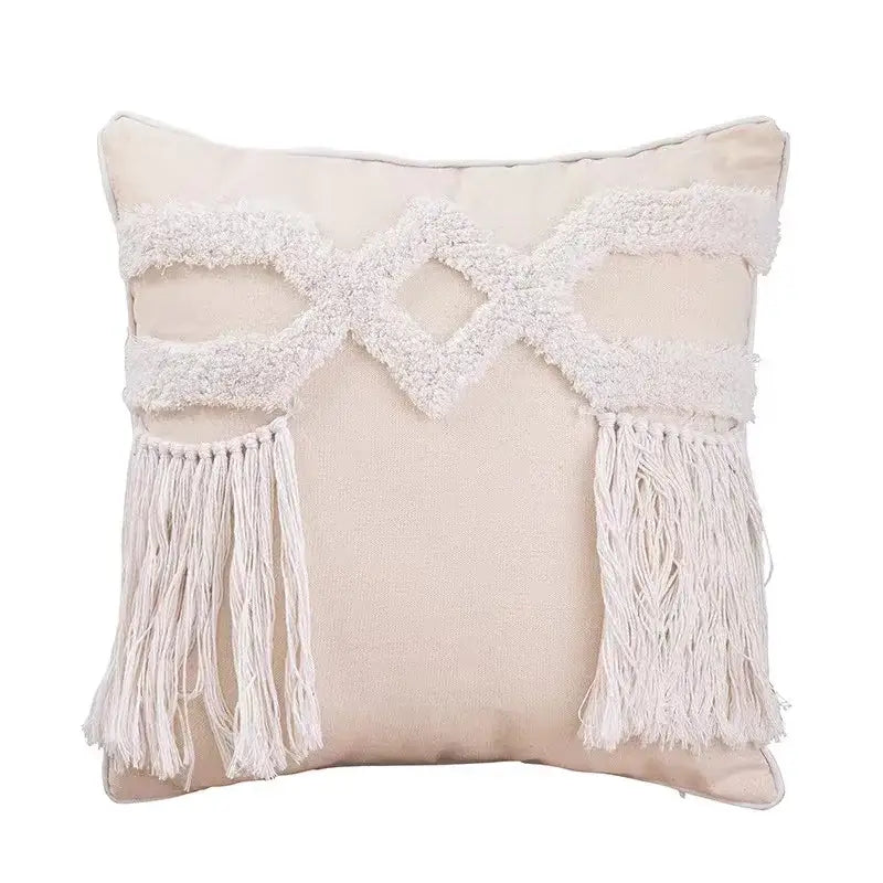 Beige geometric waves tufted pillow cover with white macrame-style fringe and tassel accents for bedroom decorbites decor
