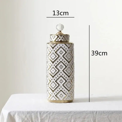 A tall 39cm ceramic decorative jar with white and golden relief geometric pattern and a crystal knob lid by decorbites geometric golden