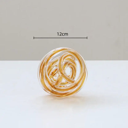 Translucent amber geometric wound glass twine sphere with intricate coils for decorbites living room decor