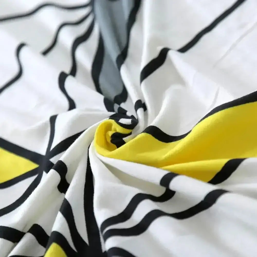 White fabric geometric stretch sofa cover with bold black wavy lines and yellow accents for living room decorbites