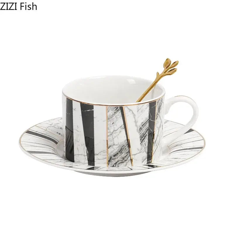 Elegant black and white marble-patterned ceramic cup with gold trim and matching saucer by decorbites gilded marble texture set