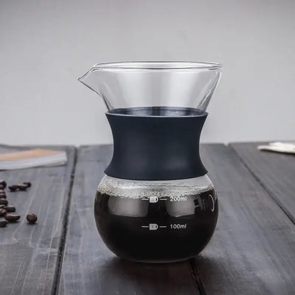 Clear glass coffee pot with matte black silicone handle and stainless steel filter with 100ml and 200ml markings