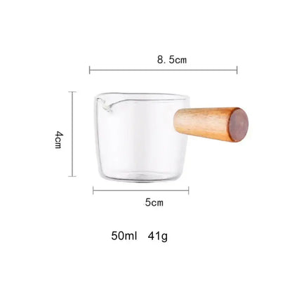 Clear glass espresso measuring cup with wood handle and 50ml capacity for kitchen milk jug use