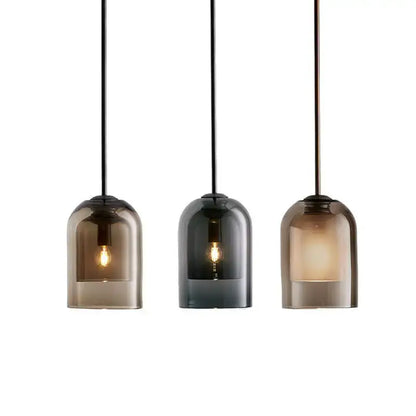 Three light glass led chandelier with smoked glass shades and black cords for dining room lighting