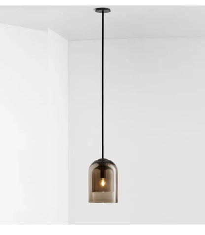 A sleek black glass led chandelier with smoked glass dome and exposed bulbs for dining room pendant lighting