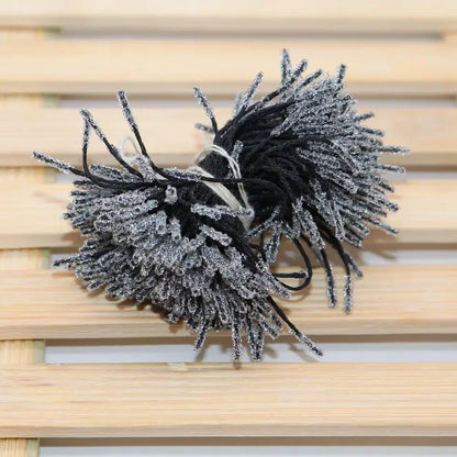 Black and silver glittery yarn pom-poms mini flower stamen hair ties for kids bedroom decor and styling