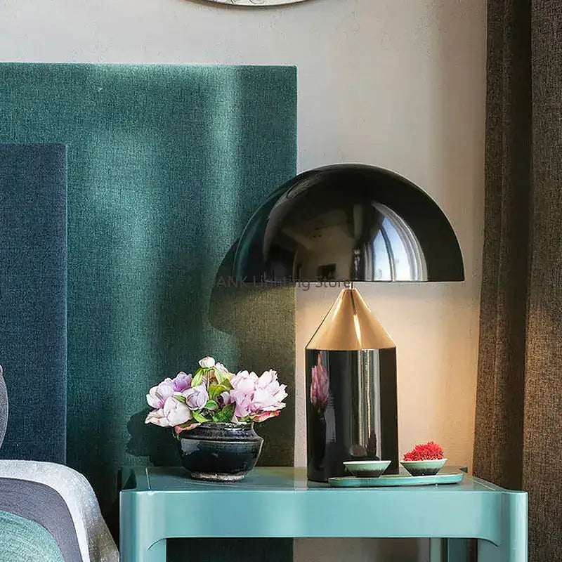 Glossy black and gold metal table lamp with sleek dome-shaped shade ideal for decorbites atollo bedroom light
