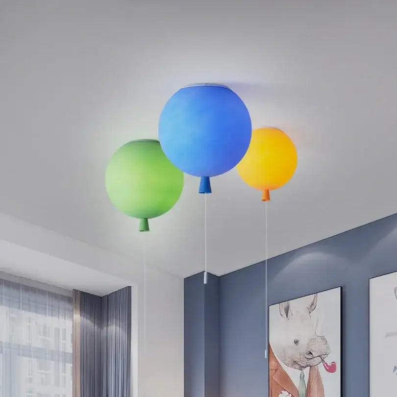 Glossy colorful balloon ceiling lamp in blue green and yellow designed as a ceiling lamp for kids bedroom