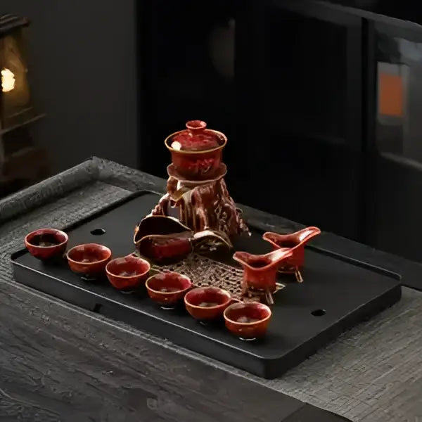 Red ceramic magnetic rotating tea set with intricate gold detailing featuring decorbites dragon teapot design