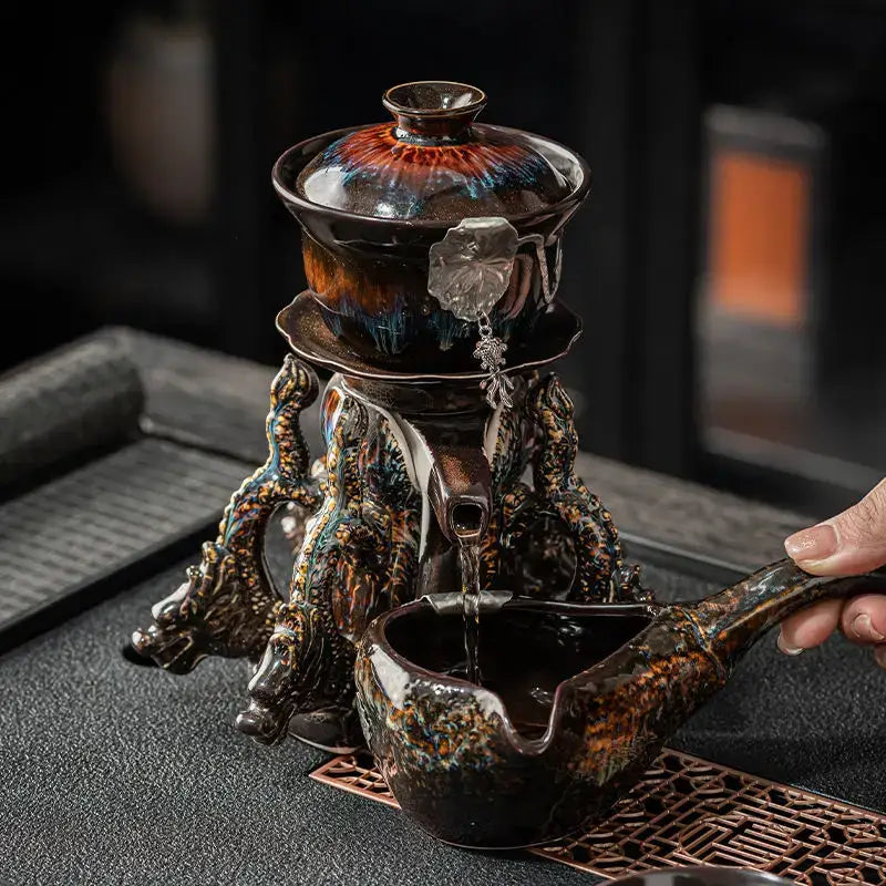 Glossy earth tone ceramic magnetic rotating tea set with iridescent glaze and dragon-shaped base decorbites dragon teapot