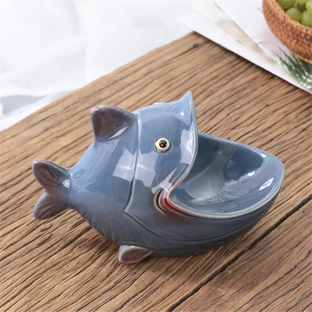 Glossy blue ceramic animal soap dish shaped like a fish with gold-rimmed eye for ceramic animal storage decorbites