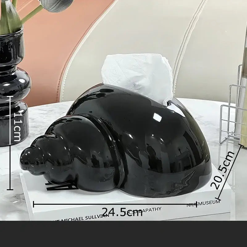 Glossy black conch ceramic tissue box by decorbites shaped like a seashell for elegant living room decor