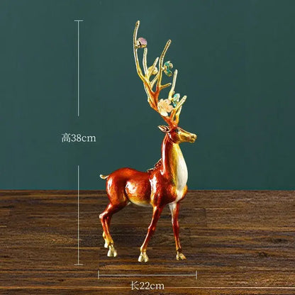 A glossy golden-brown deer figurine with gemstone antlers in a deer peace porch decoration set for living room