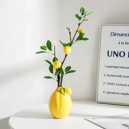 Glossy yellow ceramic lemon flower vase with green leaves and small lemons for kitchen citrus decorbites lemon decor