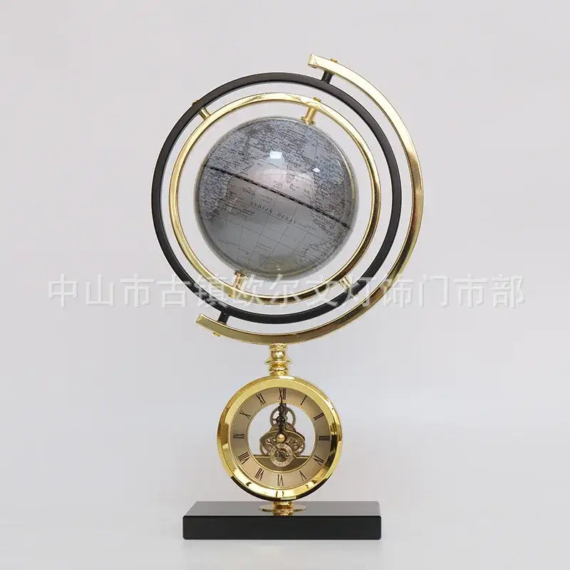 Gold and blue clock globe decoration with a detailed map on a translucent sphere in a brass frame on marble base globe decoration